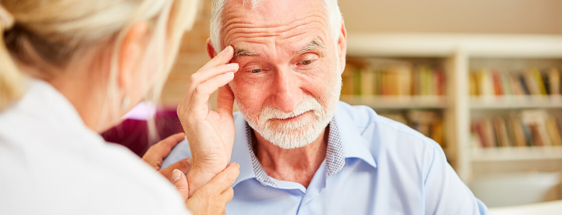 Senior,With,Dementia,Or,Alzheimer's,Is,Comforted,By,Caring,Female Senior,With,Dementia,Or,Alzheimer's,Is,Comforted,By,Caring,Female